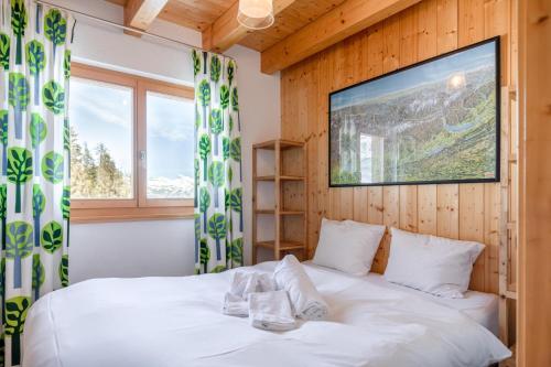 Giường trong phòng chung tại Chalet Belle Roche