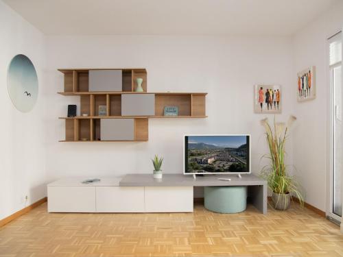 a white office with a desk with a computer on it at Apartment Residenz Marina-63 by Interhome in Bouveret