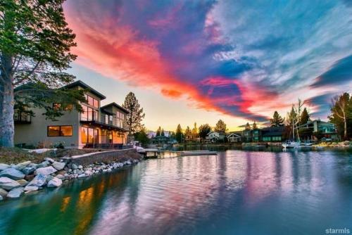 a sunset over a river with a cloudy sky at 2030 Marconi Way home in South Lake Tahoe