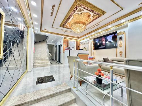 a lobby of a luxury train with a staircase at Hagia Sophia Palace Hotel in Istanbul