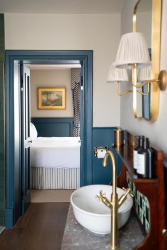 a bathroom with a white tub in a room at The Hat Maker Boutique Hotel in Dungarvan