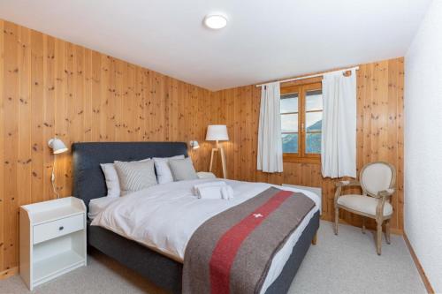 Ένα ή περισσότερα κρεβάτια σε δωμάτιο στο Chalet Les Crus