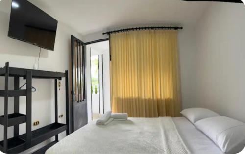 Ένα ή περισσότερα κρεβάτια σε δωμάτιο στο Apartahotel la Villa R&C