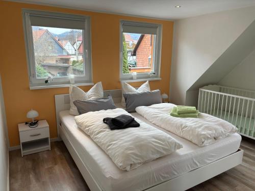 Postel nebo postele na pokoji v ubytování Modernes-Ferienhaus-im-Harz-Naehe-Wernigerode