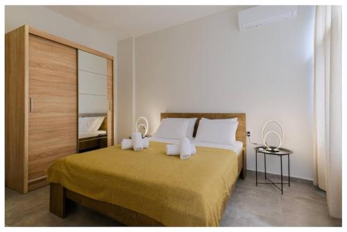 a bedroom with a large bed with two white pillows at Ladadika Vibes Apartments 2 in Thessaloniki