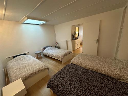 Ένα ή περισσότερα κρεβάτια σε δωμάτιο στο Domaine de l'Eculaz