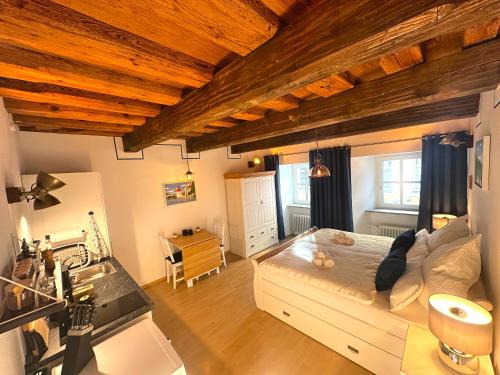 Postel nebo postele na pokoji v ubytování Gemütliches Altstadtjuwel im Herzen Passaus