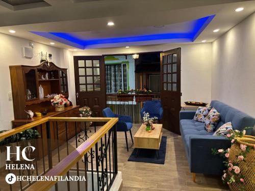 a living room with a blue ceiling at HC Helena in Filandia