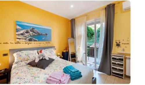 a bedroom with a bed with towels on it at oparavisegenova in Genoa