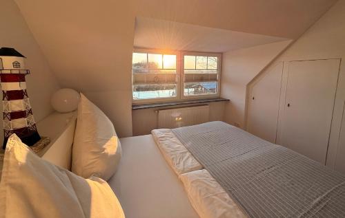 Ένα ή περισσότερα κρεβάτια σε δωμάτιο στο Ferienwohnung Blinkfüer