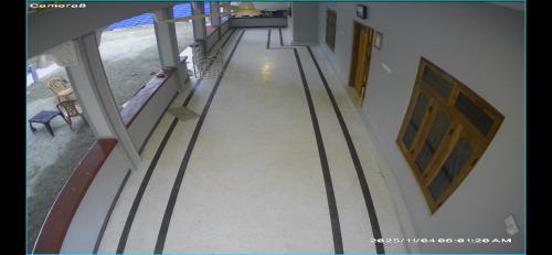 an empty hallway of a building with metal railing at DNN Brothers Villa in Jaffna
