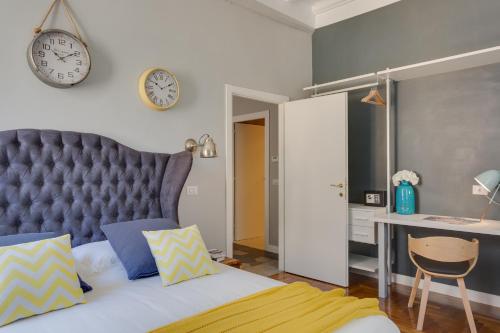 Postel nebo postele na pokoji v ubytování RomExperience Borgo Pio