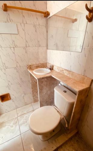 a bathroom with a toilet and a sink at centro Historico Salvador in Salvador