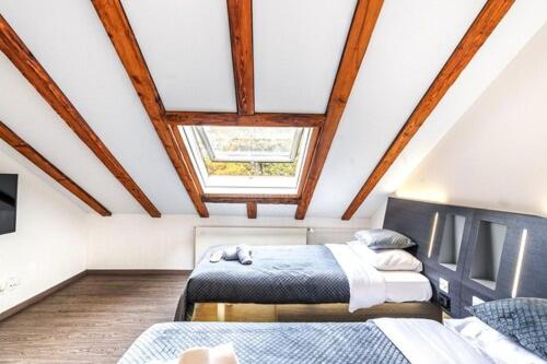 Habitación en el ático con 2 camas y tragaluz en Delta City Hotels - Self check-in, en Zúrich