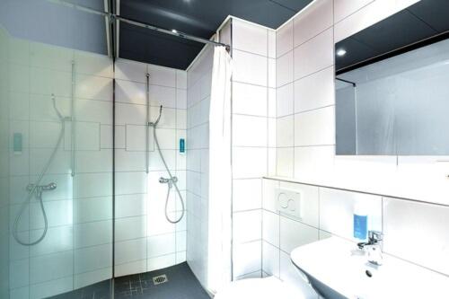 Ванная комната в Delta City Hotels