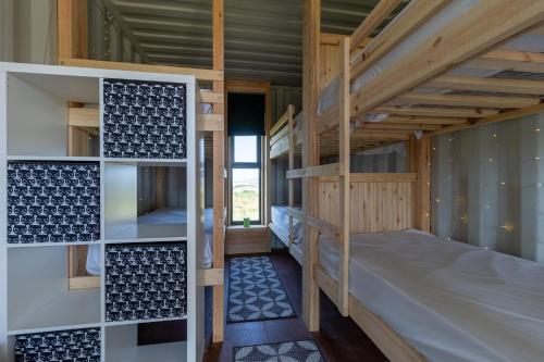 a bedroom with bunk beds in a house at 7, Rabbits Run, Camp Tapnell in Yarmouth