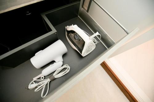 a box with a phone and other items in it at Fuji AK Vacation Rental in Fujiyoshida