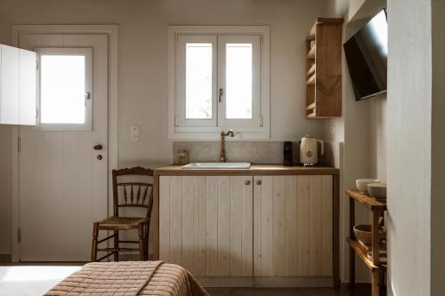 a small kitchen with a sink and a counter at Kisari Kimolos Chorio Double Room in Kimolos