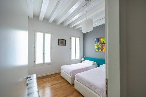 Ένα ή περισσότερα κρεβάτια σε δωμάτιο στο Rialto Suite by Venicevillas