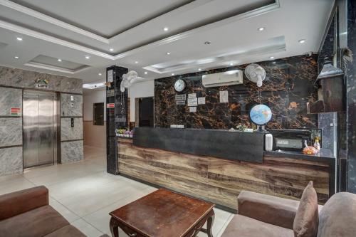 a lobby of a hotel with a reception counter at Hotel King Plaza in New Delhi