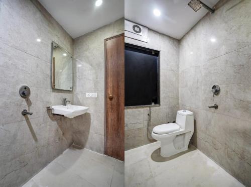 a bathroom with a toilet and a sink at Hotel City Lite Near Delhi Airport in New Delhi