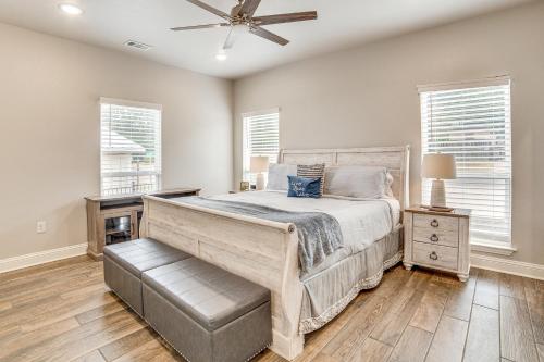 a bedroom with a bed and a ceiling fan at Private Dock and Yard! Modern Getaway in Mabank in Enchanted Oaks