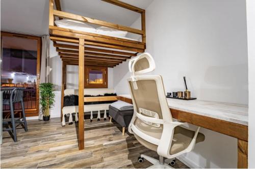 a hospital room with a chair and a bed at Ski in-out, Heart Val Thorens, Charming Studio, Wifi in Val Thorens