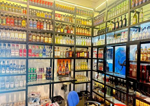 a store filled with lots of bottles of alcohol at Royal Sea Wind in Matara