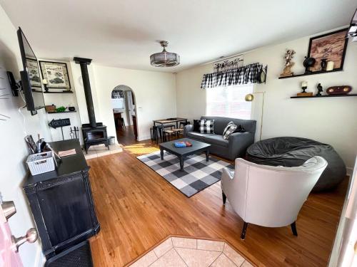 a living room with a couch and a table at POEs Place in Panguitch