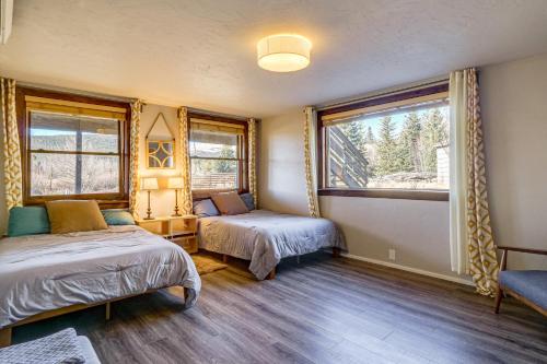 a bedroom with two beds and a window at Quiet Alma Home with Deck - 20 Mi to Breckenridge! in Alma