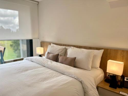 Una cama o camas en una habitación de Hotel Rioverde - Habitación Estándar