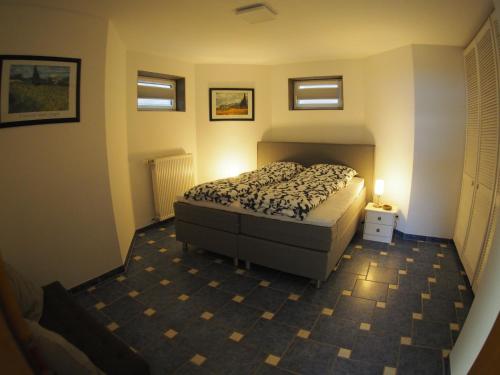 Ένα ή περισσότερα κρεβάτια σε δωμάτιο στο Am Waldrand