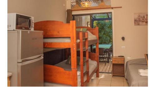 Postel nebo postele na pokoji v ubytování Abanico Suites con Kitchenette y Parking