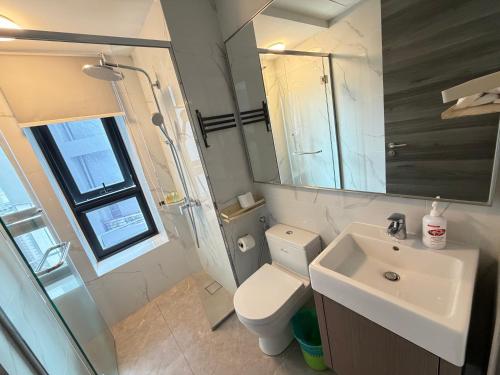 a bathroom with a sink and a toilet and a mirror at Agile bukit bintang trx by klcc sky view in Kuala Lumpur