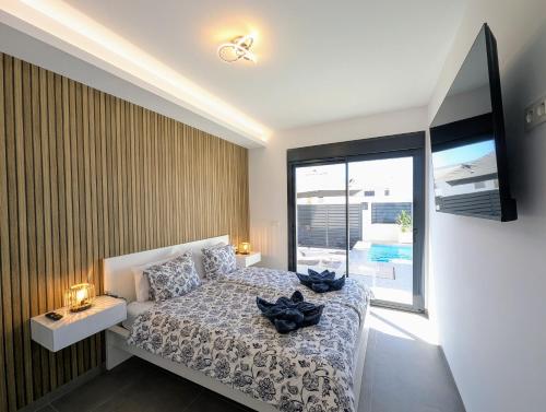 a bedroom with a bed and a large window at R-40-E Esplendor in Los Montesinos