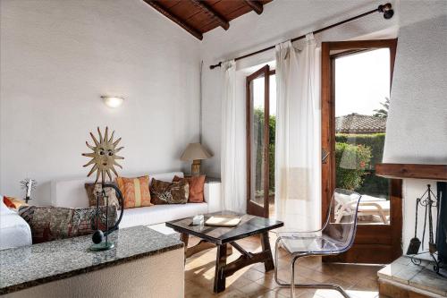 a living room with a couch and a table at Villa Roberta in Monte Nai