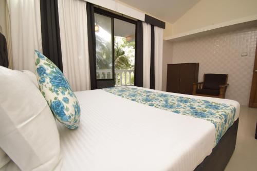 Ένα ή περισσότερα κρεβάτια σε δωμάτιο στο Luxy 3BHK Bungalow in Goa