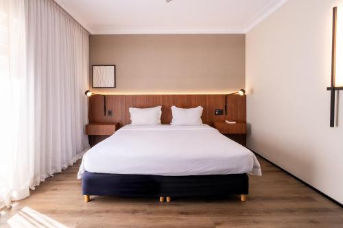 En eller flere senge i et værelse på Intercity São Paulo Paulista