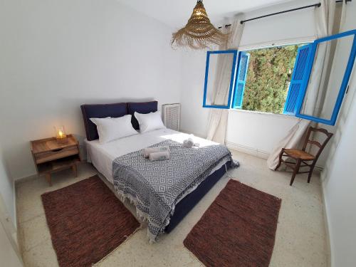 Postel nebo postele na pokoji v ubytování Spric Charming Apartment La Marsa