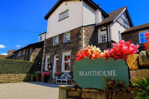 a building with a sign in front of it at Brantholme Bed & Breakfast in Ambleside