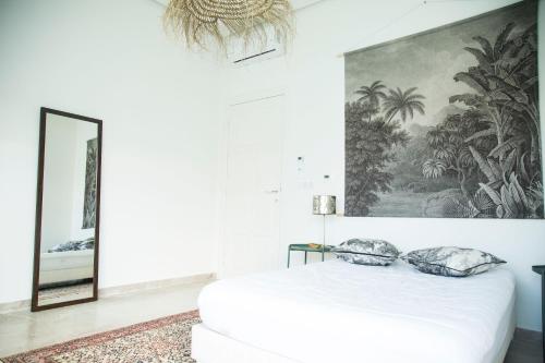 Ένα ή περισσότερα κρεβάτια σε δωμάτιο στο Les Verrières De Gammarth Piscine et confort