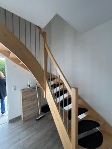 a staircase in a house with a wine cellar at Work & Travel Lodge Münsingen in Münsingen