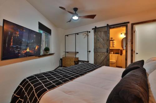 a bedroom with a bed and a ceiling fan at Hidden Dome Retreat in the Trees in Barview