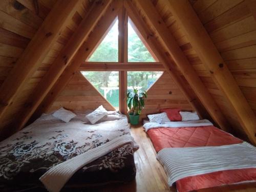 Postel nebo postele na pokoji v ubytování Cabaña Familiar