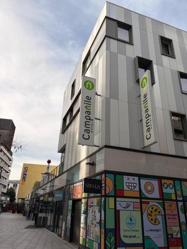 a building with signs on the side of it at Campanile Annemasse Gare– Genève in Annemasse