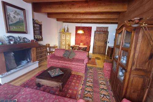 a living room with a couch and a fireplace at Apartment with fireplace near the Vauban City in Briançon