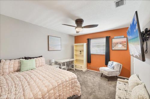 a bedroom with a bed and a desk and a chair at 227 Goldstein in Punta Gorda