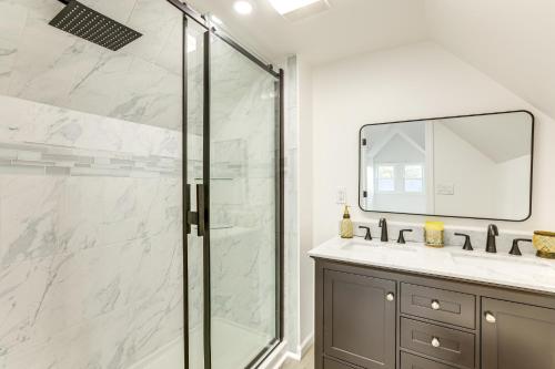 a bathroom with a shower and a sink and a mirror at 10 Mi to Lincoln Financial Field Family Home! in Colonial Manor