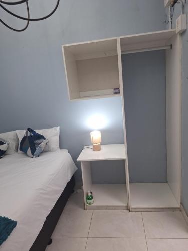 Postel nebo postele na pokoji v ubytování Oban Guesthouse Durban