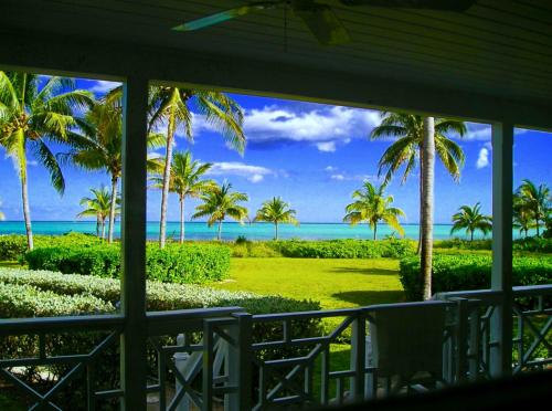 a view of the ocean from the porch of a resort at The Blue Inn Family Vacation Rental in Smith Point
